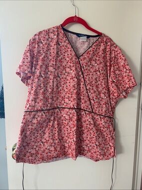 Pink Floral Wrap Tunic with Black Trim tag with size is worn but it fits like an